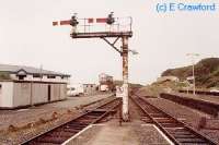 Looking north at Whitehavens former Bransty station. Signalbox in distance. The track to the left is a bay platform and that to the right a through route to Barrow.<br><br>[Ewan Crawford //]