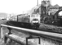 47701 <I>St Andrew</I> turns south with a train through Haymarket East Junction past the Caledonian Distillery on 18 April 1980, heading for Carstairs and the WCML.<br><br>[John Furnevel 18/04/1980]