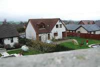 The site of Netherburn station, looking north over the housing now occupying the site from a road bridge over the former railway.<br><br>[Ewan Crawford 27/3/2005]