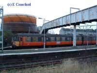 View looking south at Helensburgh Central of the last Blue Train. The Helensburgh gasworks can be seen in the background.<br><br>[Ewan Crawford 30/12/2002]