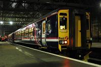 On the day First took over the ScotRail franchise a First ScotRail livery train sat in Glasgow Central.<br><br>[Ewan Crawford //]