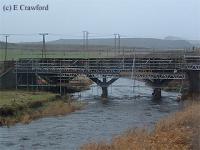 Looking north at the partly re-built wooden trestle bridge at Fordmouth. A new concrete deck was added.<br><br>[Ewan Crawford //]