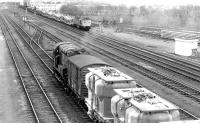 BRCW Type 2 27106 brings empty Cartics from Bathgate into the north end of Millerhill yard in April 1981. Over on the right tracklifting continues on the up side of the yard. <br><br>[John Furnevel 10/04/1981]