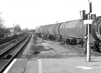 Class 47 with a train of 100t oil tanks westbound on the GW main line through West Drayton in November 1980.<br><br>[John Furnevel 18/11/1980]