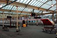 A Voyager sits in Kilmarnock station awaiting departure for Glasgow.<br><br>[Ewan Crawford 03/04/2005]