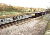 A GNER Edinburgh - Kings Cross train runs into platform 1 at Berwick on 22 March 1998 under a weak morning sun.<br><br>[John Furnevel 22/03/1998]