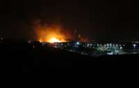 The scene looking south from Farington Junction towards Leyland at around 9 pm on 21 December 2011 with a serious fire in the business park to the west of the railway. The WCML was completely closed all evening due to the risk posed from a nearby gas main and a large number of exploding beer barrels <br><br>[John McIntyre 21/12/2011]