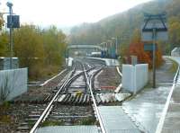 A wet November day at Garve level crossing in 2003, looking back towards the platforms.<br><br>[John Furnevel 04/11/2003]