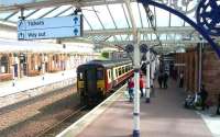 A Carlisle - Glasgow train arriving at Dumfries in February 2002.<br><br>[John Furnevel 27/02/2002]