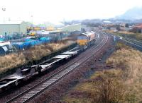 Ah yes, I remember now, I got rather wet. A class 66 takes a freight past Niddrie West Junction during a freak rainstorm in December 2002 which lasted 8 minutes - exactly how long I stood on the bridge.<br><br>[John Furnevel 21/12/2002]