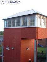 Plean Junction signalbox viewed from a neighbouring roadbridge. The view looks south. The box has been altered and now looks a little ungainly. This must be one of the tallest remaining signalboxes.<br><br>[Ewan Crawford //]