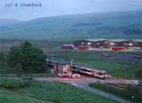 Train passing south over Blackford Level Crossing at night.<br><br>[Ewan Crawford //]