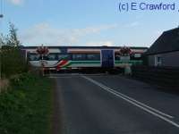 Train crossing the Forteviot Level Crossing.<br><br>[Ewan Crawford //]