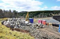 Scene at the south end of Slochd Viaduct on 28 April. Large boulders are being piled up ready to be used as infill at the site of the landslip.<br><br>[John Gray 28/04/2012]