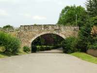 Just south of Aberlour station the line to Carron once passed under this bridge. It now forms the entrance to a car park.<br><br>[John Gray 26/07/2008]