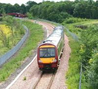 Morning train from Glasgow approaching Alloa West footbridge in June 2008.<br><br>[John Furnevel 12/6/2008]