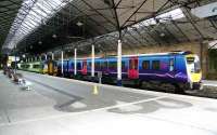 Scene inside the trainshed at Scarborough on 3 April 2008. The 0947 First TransPennine Express for Liverpool Lime Street stands at platform 4 alongside the Northern Trains 1000 service to Hull at platform 3.<br><br>[John Furnevel 03/04/2008]