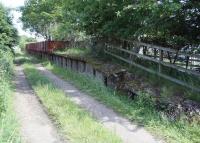 Looking north along the trackbed towards Roxburgh at the former Nisbet station on the Jedburgh branch in July 2008. The old station, now a private residence, stands behind the fence running along the platform edge.<br><br>[John Furnevel 01/07/2008]