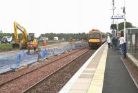 View east towards Edinburgh on 25 July 2008 showing the works currently underway on the new north side platform at Uphall station. Additional car parking facilities will also be constructed between the new platform and the M8.  <br><br>[John Furnevel 25/07/2008]