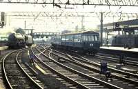 Scene at Glasgow Central circa 1960. On the left Princess Royal class pacific 46201, <I>Princess Elizabeth</I>, just released from the platform line after bringing in a train from the south, heads for Polmadie; in the centre, one of the <I>new</I> EMUs is running into the station and, on the right, an EE Type 1 is operating as station pilot.<br><br>[Colin Miller //1960]