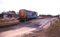 A Class 08 shunter runs through March station in 1993 on its way to Whitemoor Yard.<br><br>[Ian Dinmore //1993]