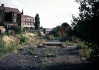 The remains of Belmont station on the former Harrow to Stanmore branch in August 1976. The station closed entirely on 3rd October 1964. Commuters on the Belmont to Harrow and Wealdstone shuttle had their most traumatic day on October 8th 1952 when their train was pulling into the south end of Harrow station as a catastrophic 3 train collision was occurring at the north end. The driver of the up Perth train was held responsible posthumously for passing signals proven to be at danger. Unofficially, those in the know did not believe he had become <I>ineffective</I> on his approach to Harrow and surmised instead that he must have become convinced in advance that his road through the station was clear. Immediately after noting the Harrow up distant at caution and coasting past it, driver Jones apparently felt able to conclude that, on the basis of the information available to him and his local knowledge, this signal had just turned green behind him (it had not). To give himself a margin of safety in case his deduction was wrong, he needed only to concern himself with the possibility of a hard stop at Harrow up fast advanced starter. On what basis could this route-experienced and conscientious driver have made such a confident (yet wrong) prediction of the Harrow signals at that moment? And in patchy fog too? <br><br>[Mark Dufton /08/1976]