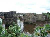 Few traces remain of the West Lancashire Railway around Preston but these bridge piers, which carried their last train in 1965, look as if they will be around a while. On the far, Preston, side of the river the line turned west for a short run into Preston Fishergate Hill station. This closed to passengers in 1900 and goods in 1965 and the site has been built over. SD 530283<br><br>[Mark Bartlett 01/08/2008]