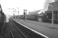 Crab 42918 of 68B Dumfries struggles south through Kilmarnock station in August 1962 - the day of my visit to Hurlford Shed. Went on the 1.15pm (SO) ex-St Enoch (1.32pm at Paisley Canal) via the Kilbirnie loop and Dalry; returned on the 6.5pm (SO) from Kilmarnock via Dalry to Paisley Gilmour Street. The photograph was taken while awaiting departure from Kilmarnock behind a standard Class 4 2-6-0, which left on time, but subsequently encountered problems raising vacuum at Lochwinnoch, with the result that the train was very late arriving at Gilmour Street. Amazing what trivia sticks in the mind after so many years!<br><br>[Colin Miller /08/1962]