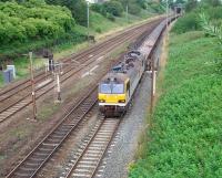 92015 on 6L30 Carlisle New Yard to Crewe infrastructure train, comprised entirely of ballast wagons, on the Up Fast line at Farington Curve Junction. The fast and slow lines diverge slightly here and the mechanical signal box once stood between them, up against Bee Lane bridge from which this picture was taken looking towards Preston. <br><br>[Mark Bartlett 01/08/2008]