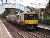 318 250 stands at the northbound platform at Blantyre on 13 October 2007 with a train for Milngavie.<br><br>[David Panton 13/10/2007]