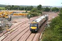 170 450 forming the 1225 Bathgate - Newcraighall about to pass under the B792 on 31 July 2008 shortly after leaving Bathgate. The depot on the left is currently occupied by the local council roads department.   <br><br>[John Furnevel 31/07/2008]