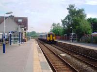 A Cumbrian Coast service, with 156444 on a through train from Maryport to Preston, calls at Silverdale. View past the former station building, now a private house, towards Arnside. <br><br>[Mark Bartlett 05/08/2008]