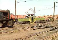 NCB Westoe, South Shields, in the summer of 1983, with German built electric locomotive no 9 taking a rake of wagons past a Barclay diesel standing in the yard. Westoe Colliery, once the Jewel in the Crown of the Harton Coal Company, eventually closed in 1993, the last operational pit on Tyneside. Locomotive No 9 (AEG 1565 of 1913) is now preserved on the Tanfield Railway.<br><br>[Colin Alexander //1983]