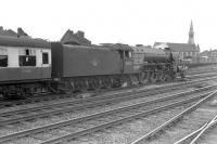 Class A1 Pacific 60133 <I>Pommern</I> stands at Doncaster with a southbound train in the early 1960s. Introduced in 1948, the locomotive spent much of its life at 56C Leeds Copley Hill before being finally withdrawn in 1965. In the background, with the distinctive spire, stands the Church of St James, Doncaster, completed in 1858 to cater for the spiritual needs of the growing population of the town (mainly as a result of the arrival of the railway) and paid for primarily by the shareholders of the Great Northern. [With thanks to David Pesterfield.] <br><br>[Robin Barbour Collection (Courtesy Bruce McCartney) //]