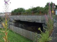 The bridge at the east of the old Loch Leven station, which carries the B996 south from Kinross. The station was to the left of shot. The old smoke deflectors are still in situ [see image 17439]. All rail use ceased early 1971, when the line was closed to allow the construction of the M90.<br><br>[Brian Forbes 10/08/2008]