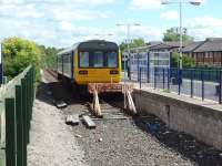 <I>Did they run out of track?</I> 142035 stands a little short of the station entrance at Morecambe waiting to leave for Leeds via Lancaster. <br><br>[Mark Bartlett 08/08/2008]