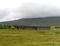 With mist rolling in off the fells, a pair of 158 DMUs heads south over Ribblehead viaduct towards Leeds on 10 August 2008.<br>
<br><br>[John McIntyre 10/08/2008]