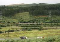 A northbound Cross Country Voyager ascending Beattock in August 2008 overtakes a pair of articulated lorries heading north on the parallel M74 motorway<br><br>[John Furnevel 11/08/2008]