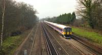 An eastbound service destined for Waterloo at speed on the long straight section between Basingstoke and Hook in February 1992.<br>
 <br><br>[John McIntyre 26/02/1992]