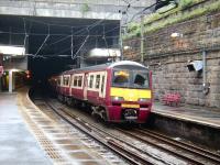 Balloch bound 320 315 gets wet in the brief gap between the tunnels at Charing Cross on 9 August. <br><br>[David Panton 09/08/2008]