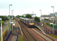 An Aberdeen to Glasgow service accelerates through Golf Street after a stop at Carnoustie, half a mile away, on 31 Jul 2008. With one service per day each way Monday to Saturday Golf Street and nearby Barry Links vie for bottom position in the Scottish passenger league.<br><br>[David Panton 31/07/2008]