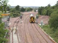 Scene approaching Bathgate on 14 August 2008. New track and signalling are in place on the existing single operational line, the new westbound line and the line on the left which will serve the light maintenance depot. In the background ballast is being laid through the cleared area created by the demolition of Rennies Bridge towards the east end of the existing STVA compound.<br><br>[John Furnevel 14/08/2008]