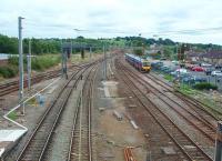 The view south from Lancaster up the bank towards Oubeck and on to Preston. From left to right the tracks, all in regular use, are: Up Passenger loop 2, which rejoins the main line but also continues as a goods loop, Up Passenger loop 1, Up Main, Down Main and Down Passenger loop. Pennine unit 185143 has been stabled in a siding on the down side.<br><br>[Mark Bartlett 13/08/2008]