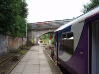 Once a through mainline station, Kirkby now has an end on meeting of services similar to that at Ormskirk. 150203 has arrived on a service from Rochdale, having travelled down the single line section from Rainford Junction, and the passengers have walked forward to the waiting EMU for Liverpool. <br><br>[Mark Bartlett 13/08/2008]