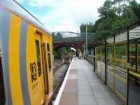 Merseyrail EMU 507015 has made the connection with the Sprinter for Wigan, Manchester and Rochdale that is on the far side of the road bridge and is now ready to go back down the single line section to Fazackerley on its way to Liverpool. The EMUs offer a 15 minute service but the DMU to Wigan is only hourly and the last train is at 1843hrs. <br><br>[Mark Bartlett 13/08/2008]