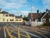 Hospital Crossing, lies one mile east of, and is visible from, Bamber Bridge station in a suburb of the town. There was never a station here but a substantial crossing keepers cottage survives although the busy crossing is now operated remotely. <br><br>[Mark Bartlett 16/08/2008]