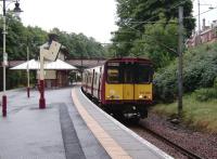 The driver of 314 208 bound for Newton on 9 August checks the doors on the monitors before leaving Maxwell Park.<br><br>[David Panton 09/08/2008]