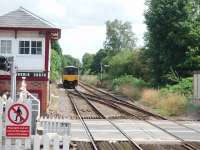 View towards Appley Bridge and Wigan on 13 August as 150142 leaves Parbold, a station that has everything. Semaphores, crossing, subway, a staffed ticket office in the orginal station building and two trains an hour in each direction that can be viewed from the garden or lounge of the adjoining pub. <br><br>[Mark Bartlett 13/08/2008]