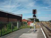 For many years the EMU depot at Hall Road serviced the Liverpool Southport electric trains but, although it still stands alongside Hall Road station its work has been taken over by Kirkdale depot, the tracks have been lifted and the building is now empty. View towards Hightown and Southport showing the former turnback siding and depot access line. <br><br>[Mark Bartlett 13/08/2008]