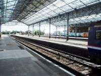 The trainshed at Southport <I>Chapel Street</I> still spans six platforms plus an EMU stabling road. Platforms 1 to 3 on the right service the Liverpool EMUs and 4 to 6 the diesel trains for Wigan, the lines dividing immediately outside the station. Platform 3 on the opposite side of the island to the Sprinter is the only line that can access both routes.  <br><br>[Mark Bartlett 13/08/2008]